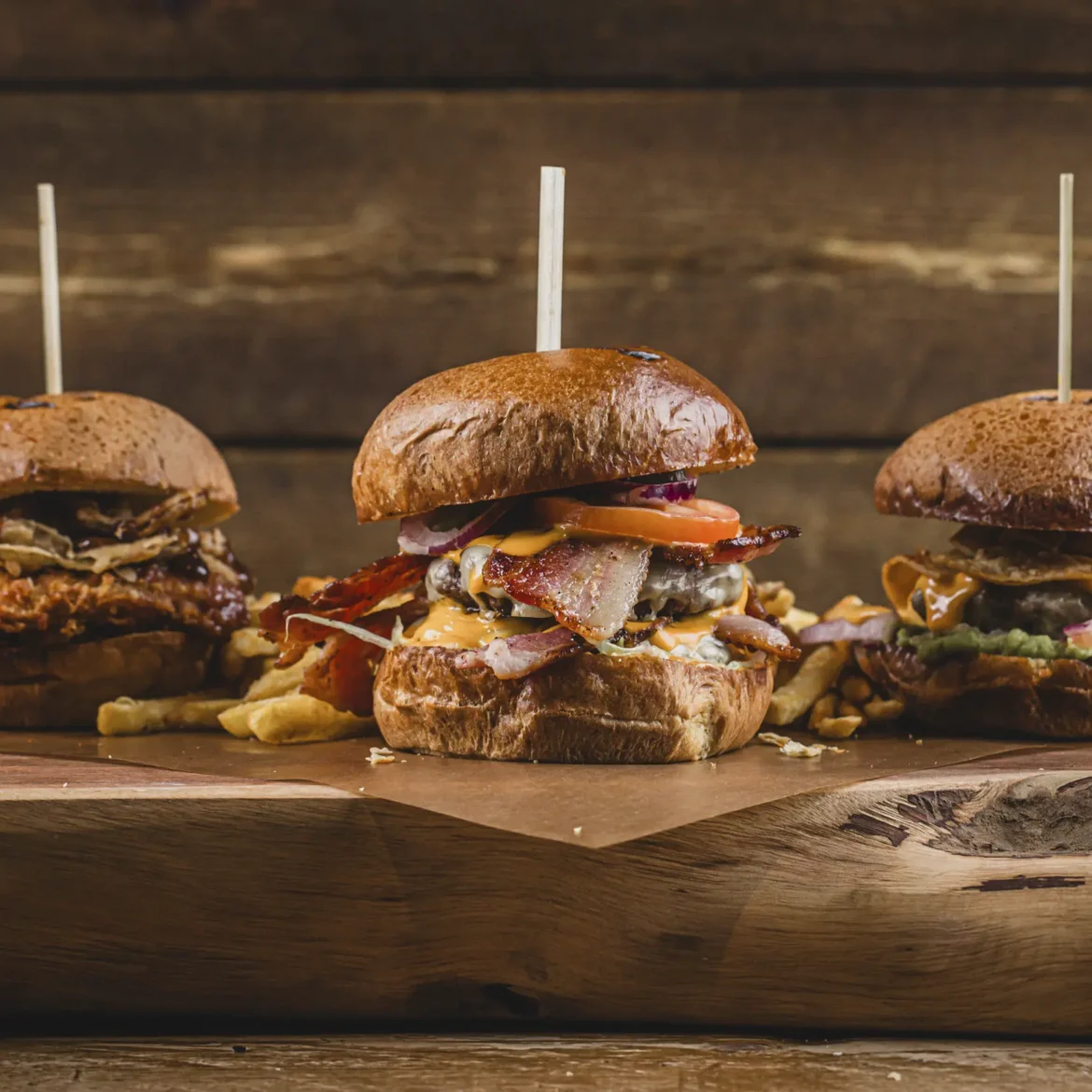 Belushi's loaded burger menu featuring multiple globally inspired burgers with fries, the ultimate World Cup sports bar food